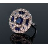 18ct white gold large circular sapphire and diamond dress ring consisting of a central round