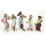 Five Meissen hand painted porcelain monkey band figures, circa 19th Century, each with Meissen