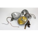 Three vehicle headlamps, including two by Lucas (all different), diameter 15cm approx., untested,