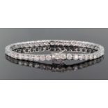 18ct white gold tennis bracelet set with fourty three round brilliant cut diamonds with a total