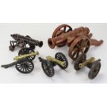 Five decorative cast iron & brass cannon, largest - length 33cm, height 13cm approx.