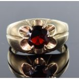 9ct Gents ring set with a single 8mm round garnet in claw setting, finger size Q, weight 4.6g