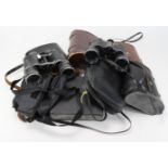 Binoculars. A collection of nine pairs of binoculars, mostly in original cases