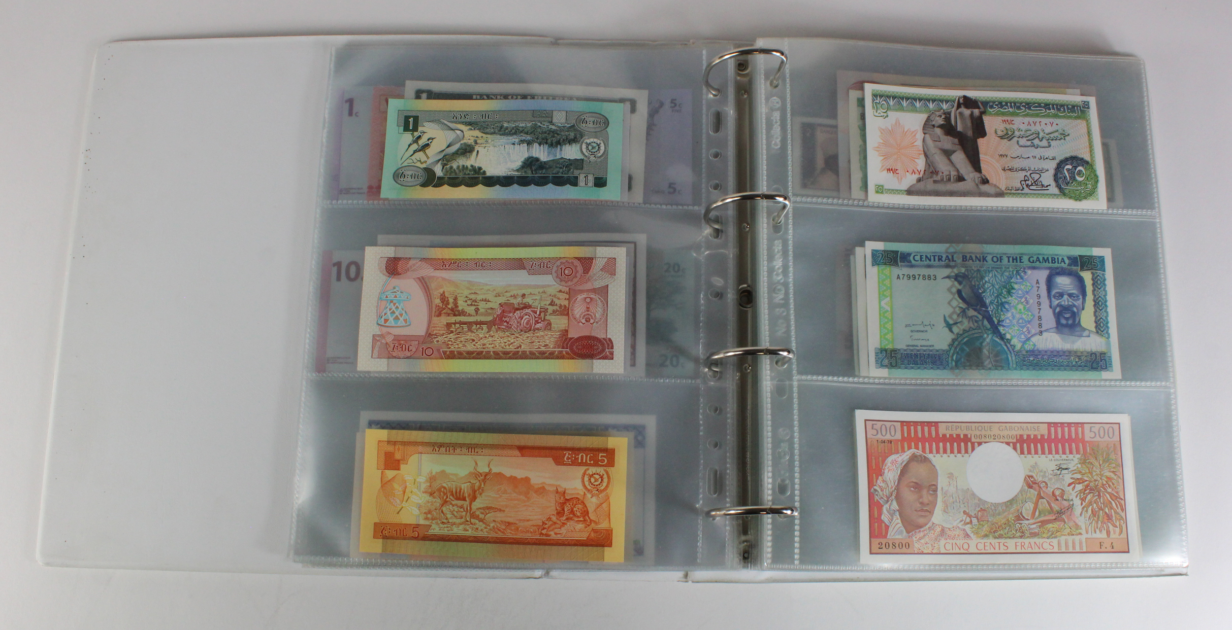 World, Africa (151) a superb collection of Uncirculated notes in an album, Algeria, Angola, - Image 12 of 44