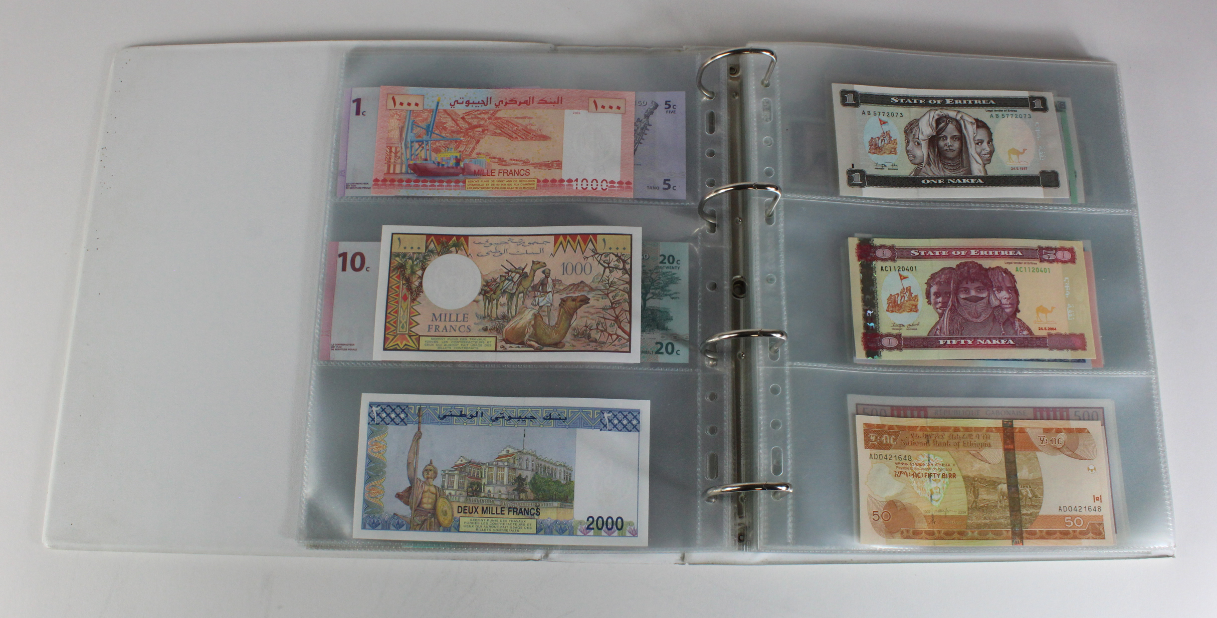 World, Africa (151) a superb collection of Uncirculated notes in an album, Algeria, Angola, - Image 9 of 44