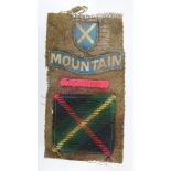 Badge a Scottish Mountain Divisional badge set sewn onto Battledress serge