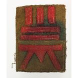 Badge a Welsh Divisional badge set sewn onto Battledress serge