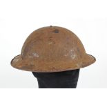 WW1 British Brodie helmet with most of its original paint finish minus its lining and chin strap.