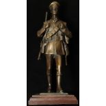 WW1 interest - a superb heavy bronze statuette of a marching 'Old Contemptible Tommy'. 25cm tall,