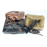 WW2 British Army equipment including binoculars in leather case, armed fighting vehicle first aid