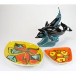 Poole pottery- three pieces of Poole pottery. Two dolphins, and two delphis dishes, (one a/f). (3)