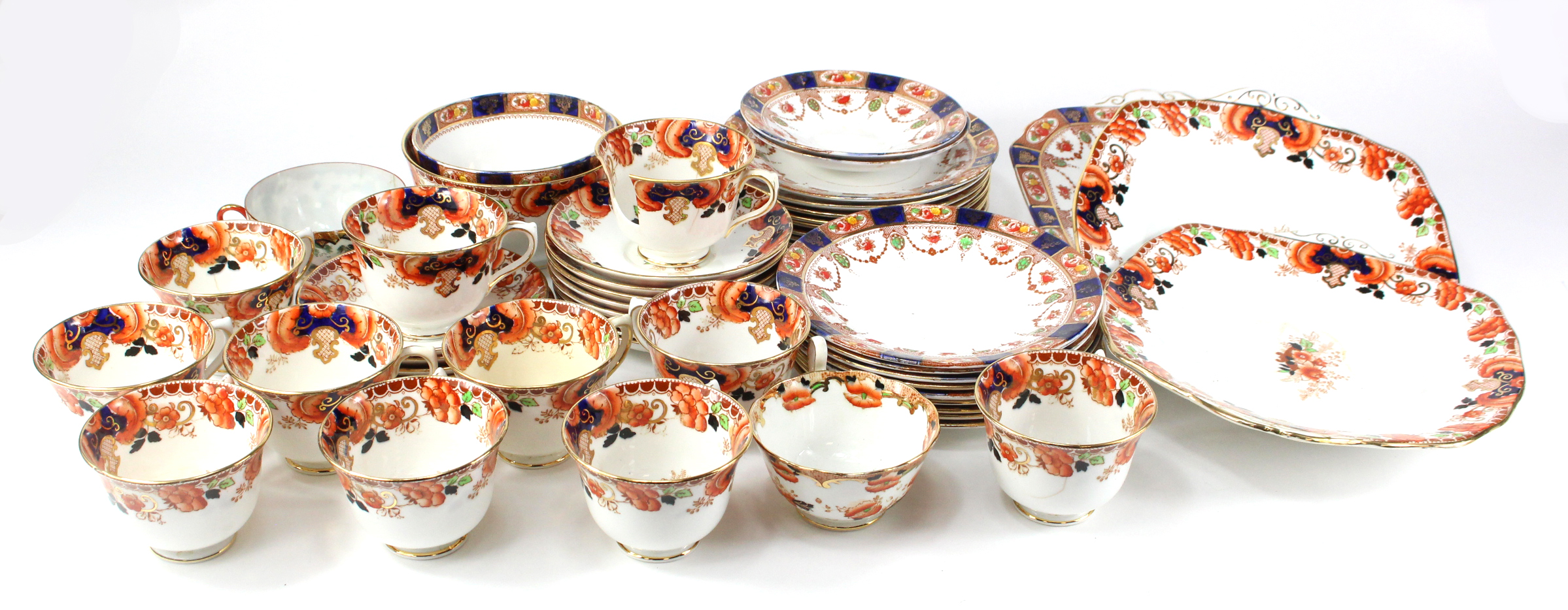 Royal Albert part tea set consisting of nine trios, sugar bowl and cake plate.