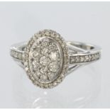 9ct white gold ring in a multi stone oval cluster with a total diamond weight of 0.535ct, finger