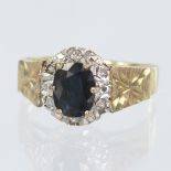 9ct yellow gold cluster ring set with a centre sapphire measuring approx. 8mm x 6mm, surrounded by