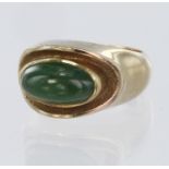 9ct yellow gold ring set with a single elongated oval jadeite cabochon measuring approx. 12mm x 7mm,