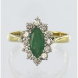 18ct yellow gold cluster ring consisting of central marquise shaped emerald measuring approx. 10mm x