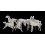 Seven white porcelain horses, in various poses, circa early to mid 20th Century, a few with slight