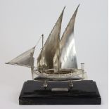 Maltese silver model depicting a two masted boat, with Maltese silver hallmarks, mounted on a wooden