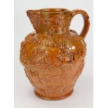 Brewery interest. A 19thc treacle glazed jug of large proportions measuirng 29cm high. Decorated