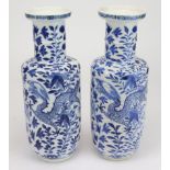 Chinese interest - Pair of blue and white painted rouleau vases decorated with a four claw dragon
