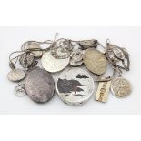 Silver. A collection of silver lockets, pendants, compact, etc., weight 5.9 oz. approx.