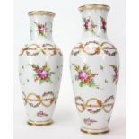 Pair of hand painted porcelain vases, decorated with sprays of flowers. Marked Dresden with crown in