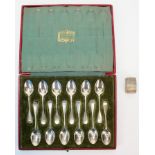 Boxed set of Harrod silver spoons (12) and a small hallmarked silver vinaigrette.