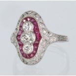 Platinum Drt Deco style diamond and ruby eleogated oval ring set with three principal round