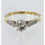 18ct yellow gold and platinum ring set with single round brilliant cut diamond weighing approx. 0.