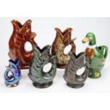 Ceramics- A collection of gurgle jugs. To include, Dartmouth brown fish, duck, Fosters brown and