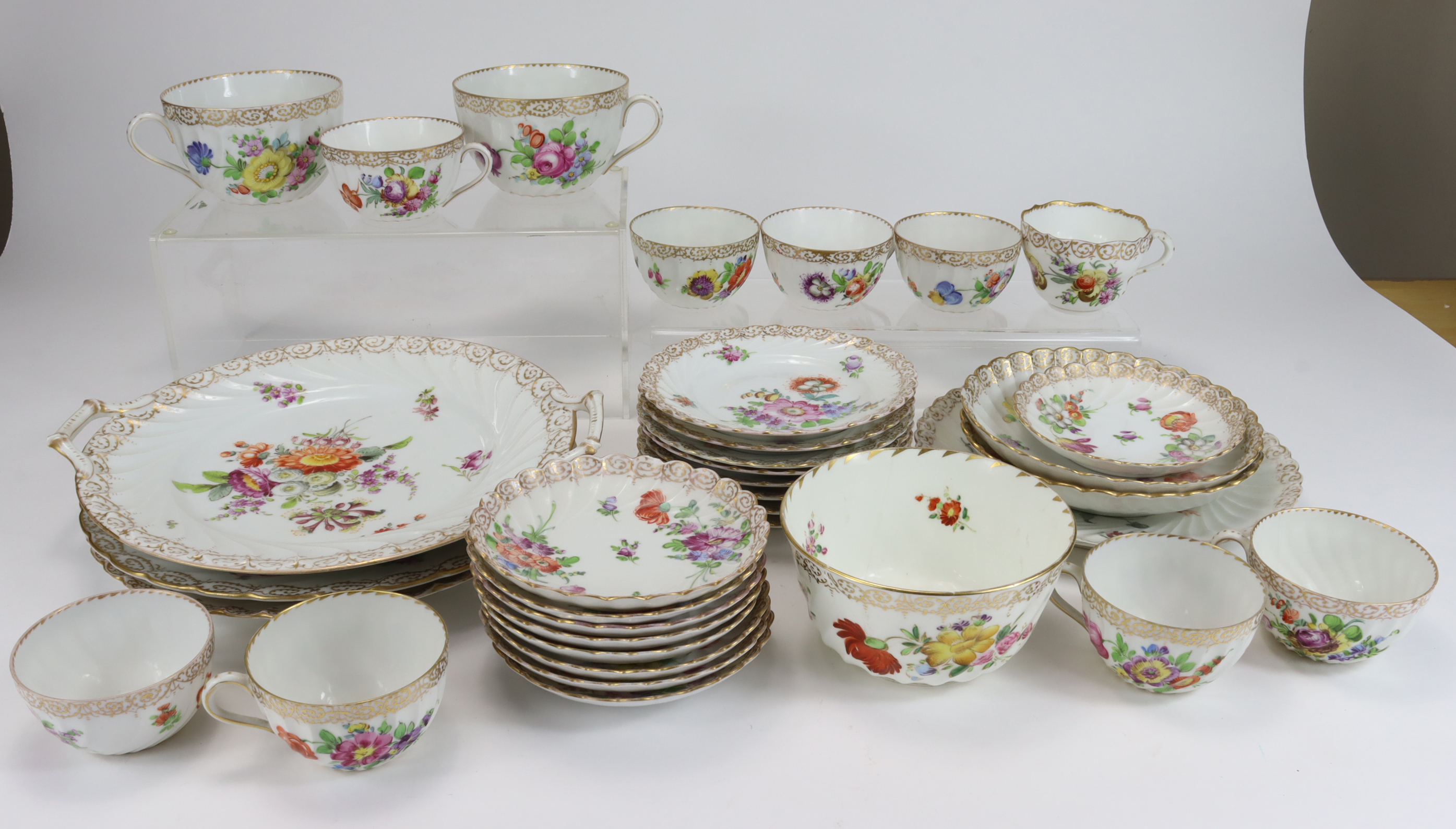 Dresden part tea service (35) decorated with hand painted floral sprays. Marked with blue Dresden