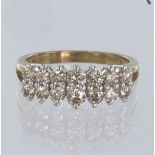 9ct yellow gold ring set with two graduated rows of round brilliant cut diamonds with a total