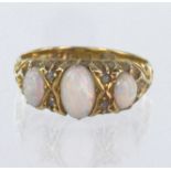 18ct yellow gold ring set with three graduated oval opal cabochons all claw set with carved shoulder