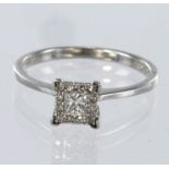 9ct white gold diamond set ring with a central princess cut diamond weighing approx. 0.10ct