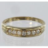 9ct yellow gold half eternity ring set with seven round brilliant cut diamonds totalling approx. 0.
