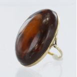 9ct yellow gold ring set with large oval amber cabochon measuring approx. 4cm x 2.5cm, finger size