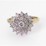 18ct yellow gold three tier diamond cluster ring with central round brilliant cut diamond weighing
