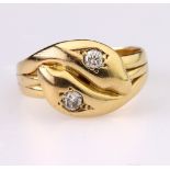 18ct yellow gold double snake head ring each set with a single round brilliant cut diamond