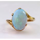14ct yellow gold dress ring set with an oval opal cabochon measuring approx. 13.5mm x 9mm in a