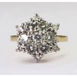 18ct yellow gold cluster ring set with a central round brilliant cut diamond weighing approx. 0.