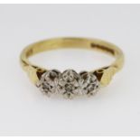 18ct yellow gold diamond set three stone illusion setting ring with rib design shoulders, total