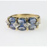 9ct yellow gold dress ring set with six oval tanzanite, measuring approx. 10mm x 4mm, with four