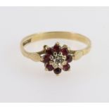 9ct yellow gold cluster ring set with central round diamond weighing approx. 0.01ct in an illusion