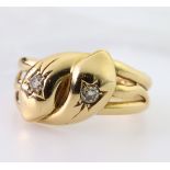18ct yellow gold double snake head ring, each snake head set with a single round old cut diamond