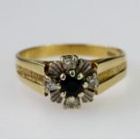 18ct yellow gold ring set with central round sapphire measuring approx. 4mm diameter, with four