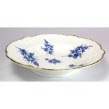 Nantgarw porcelain dish with embossed borders, with blue floral decoration & gilt rim, impressed