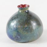 Bernard Moore- A small squat vase in blue/green flambe glaze with red interior. Within the glaze are