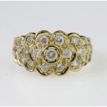 9ct y ellow gold ring set with multiple round cz in a cluster design extending to the shoulders,