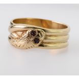 9ct yellow gold triple coil snake ring with patterned head and garnet eyes, finger size X, weight