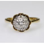 18ct and platinum diamond cluster ring consisting of nine round brilliant cut diamonds totaling